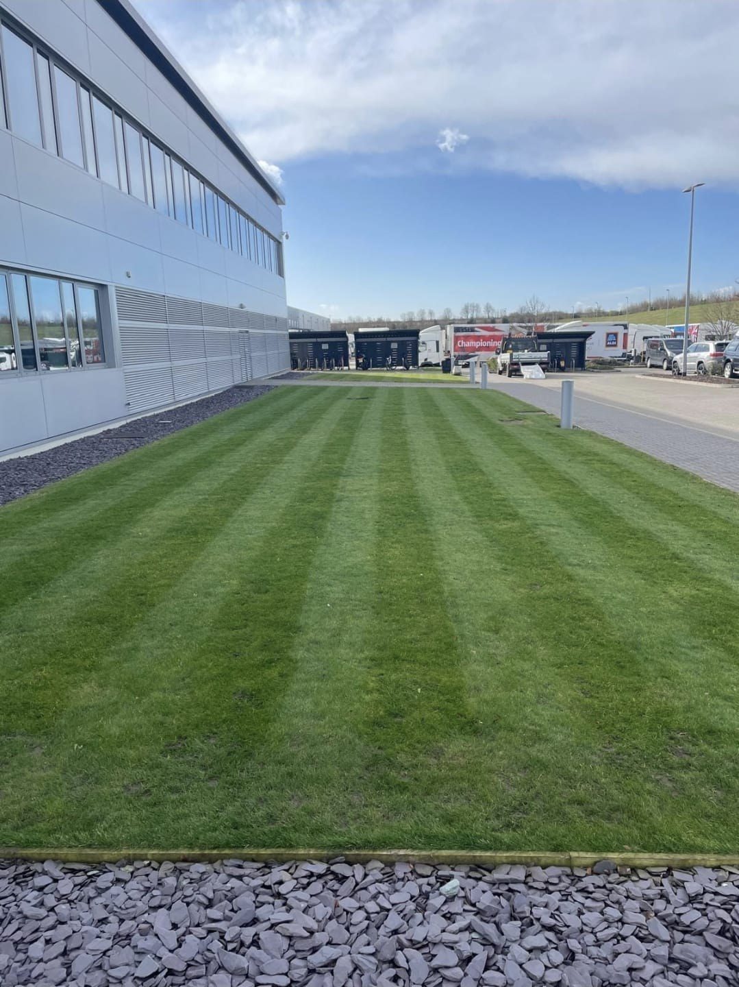 Striped lawn outside a commercial unit